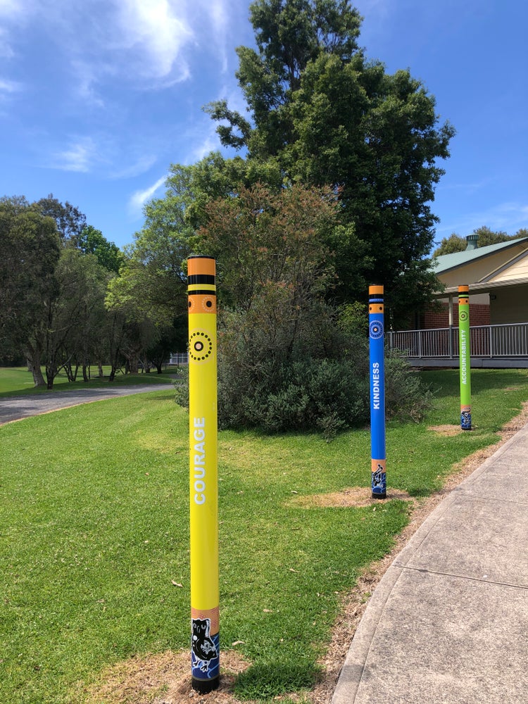 Poles with our values written on them